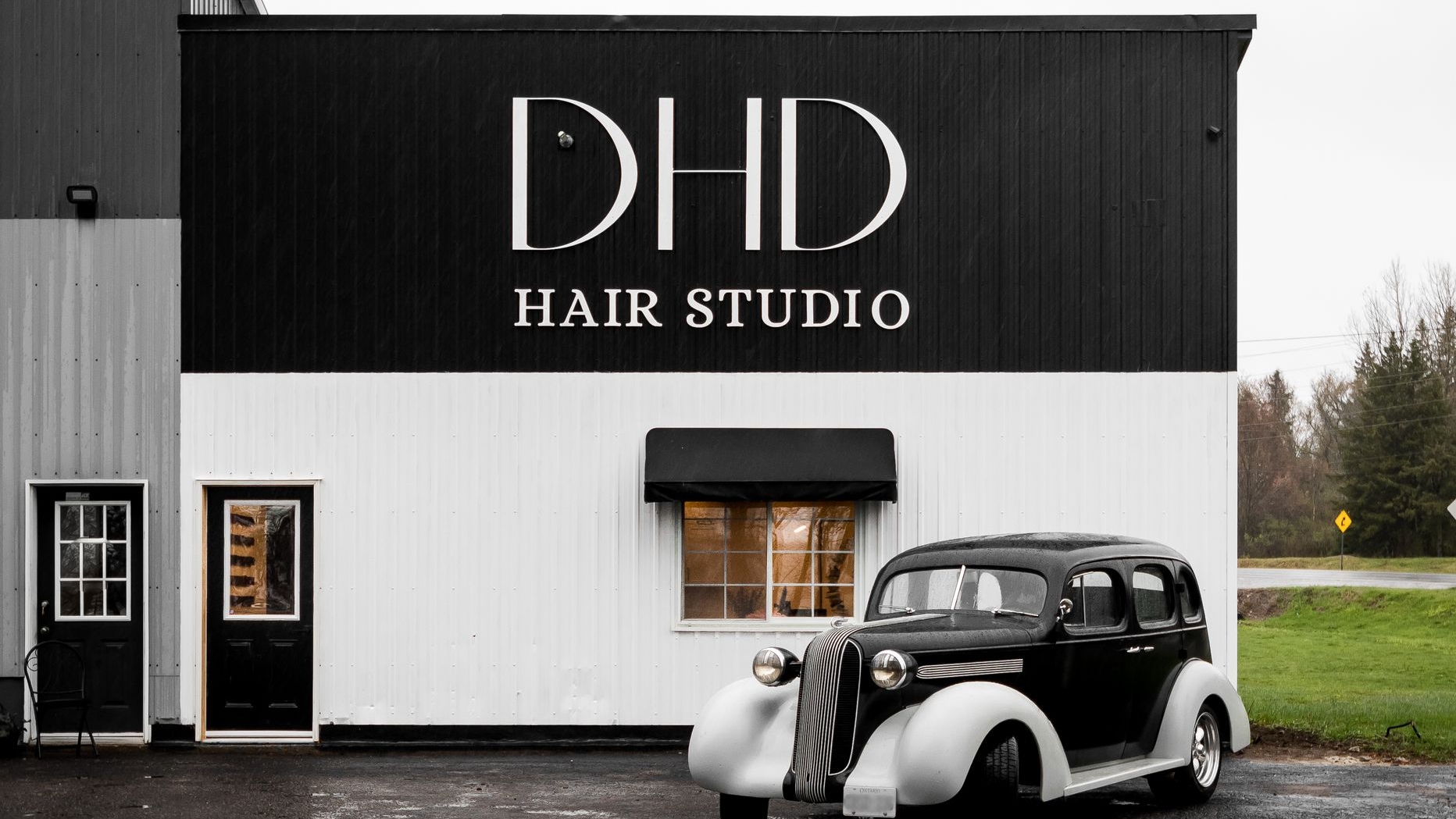 DHD Hair Studio storefront in Burk's Falls with vintage car